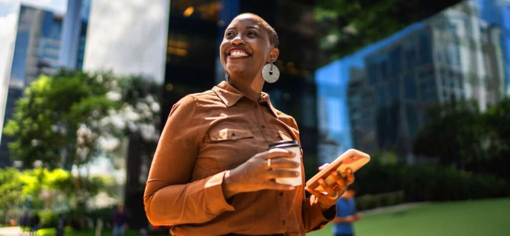 happy woman outside on phone